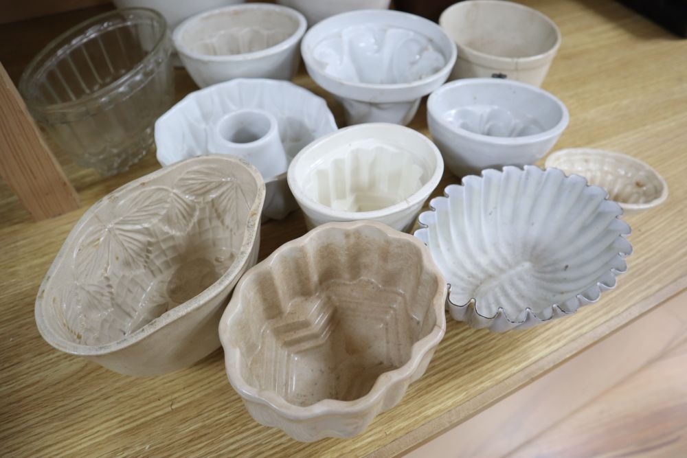 A collection of ceramic and toleware jelly moulds